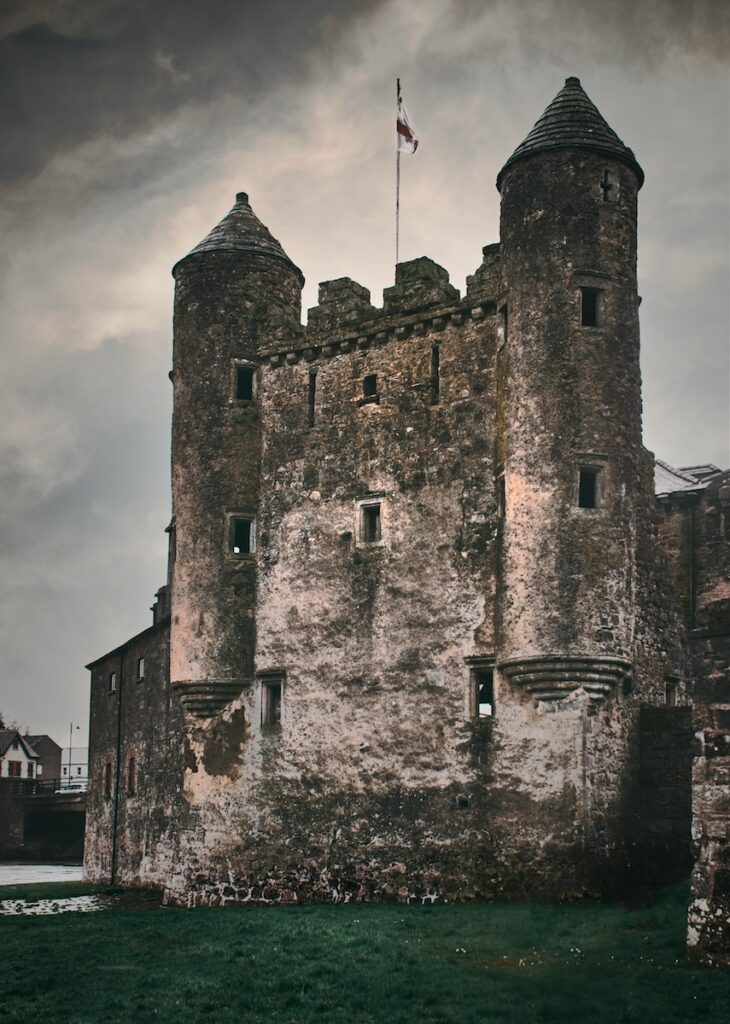 gray concrete castle under cloudy sky