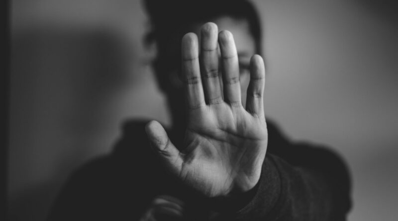 close-up photography of person lifting hands