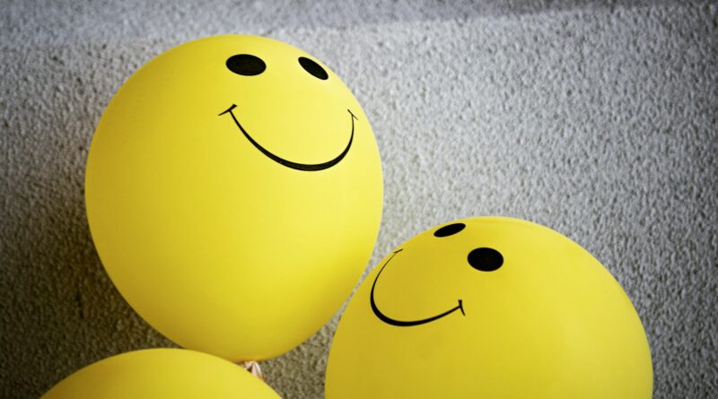 yellow smiley emoji on gray textile