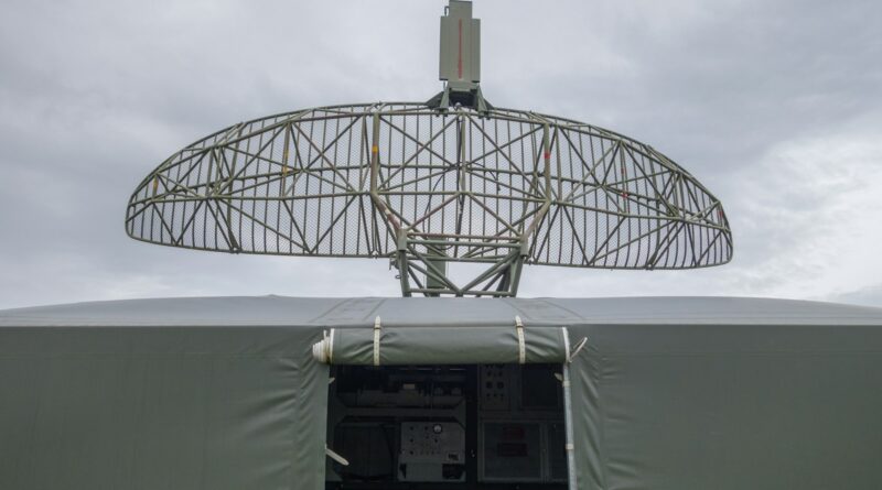 a satellite dish mounted on top of a military vehicle