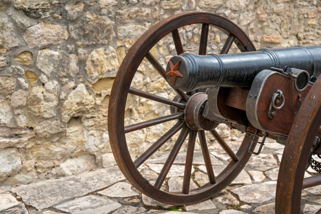 a close up of a cannon on a stone ground