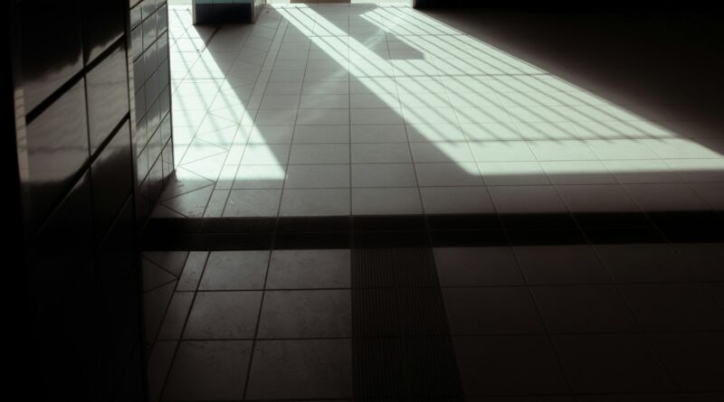 a room with a tiled floor and a large window