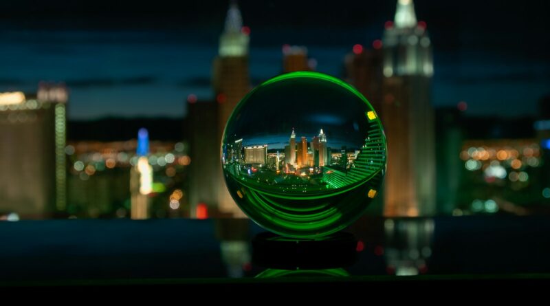 green glass ball with city lights during night time