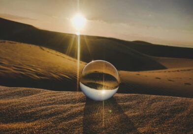 A crystal ball reflecting sunlight on desert dunes, captured in Lanzarote, Spain.