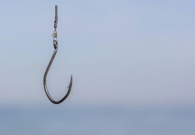 a fishing hook hanging from the side of a boat